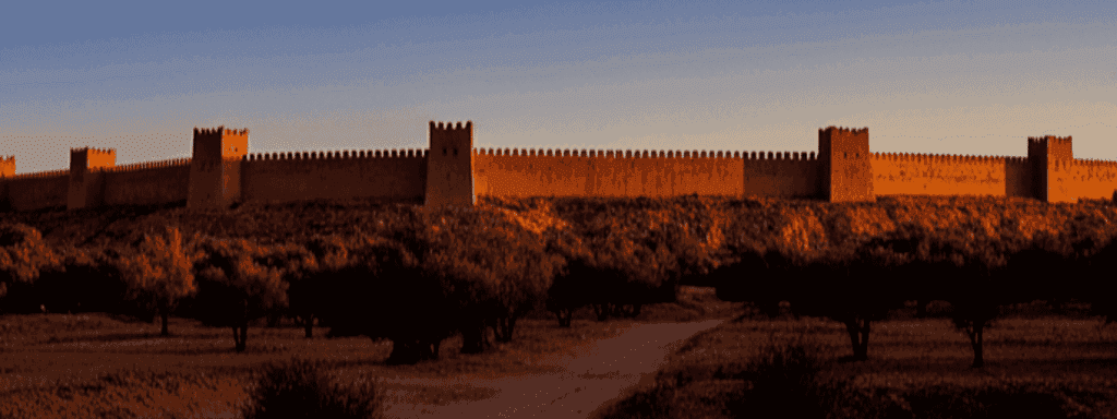 Morocco walker travel blog - Taroudant The Ramparts A Belt of Clay and Chronicles - Picture yourself on a creaking bicycle—the undisputed king of transport here. Circling the ramparts is your first initiation. The earth from which they are built feels as though it still carries the warmth of the Saadian labor of the 16th century, when they made this city their ephemeral capital before the conquest of Marrakech.