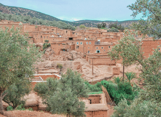 walking the world, through Moroccan eyes. morocco walker morocco walker travel blog - Exploring Sidi Ifni and Guelmim Through the Rise of Ayyoub Bouaddi - 2. Sidi Ifni The Blue and White Mirage on the Red Cliffs